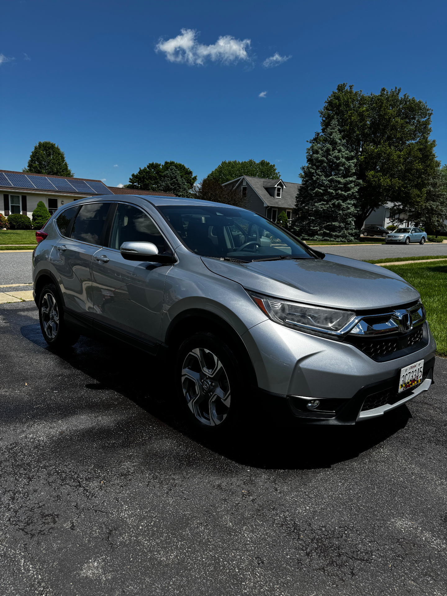Polished silver SUV exterior after detailing